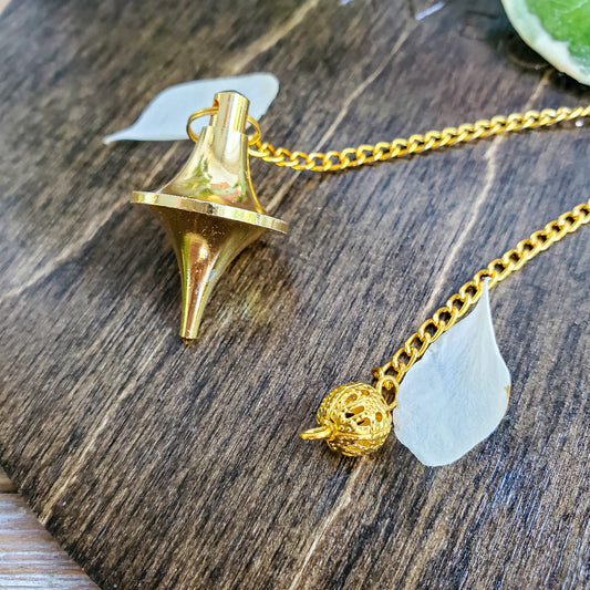 Brass spinning top-style pendulum for dowsing
