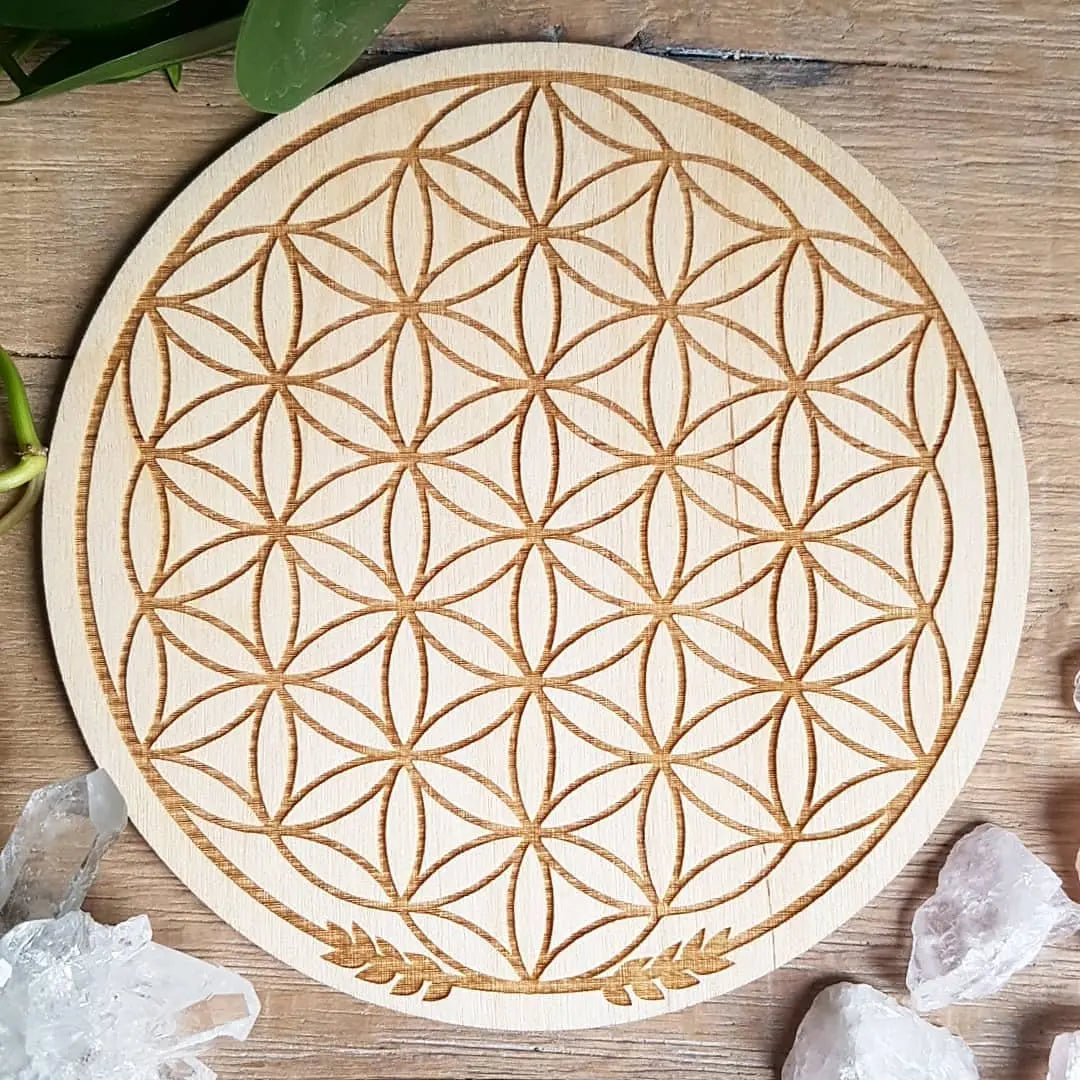 Flower of Life laser-etched wooden crystal grid