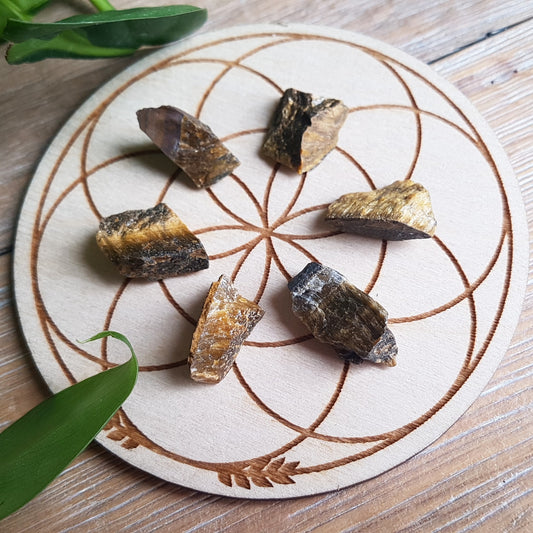 Raw tiger eye stones, natural rough golden-brown chatoyant crystal