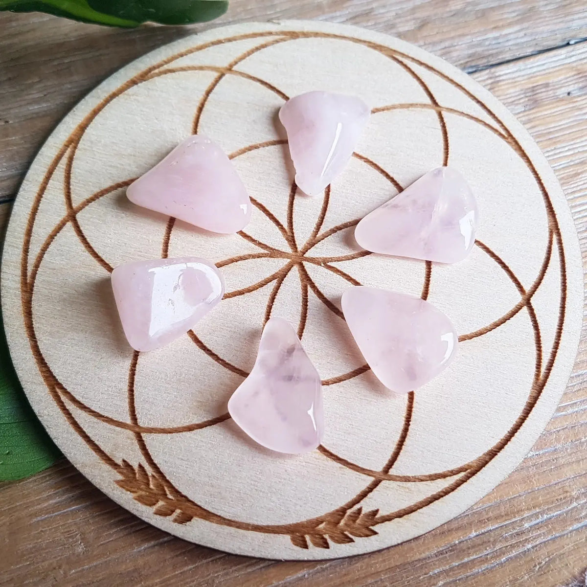 Tumbled rose quartz stones, pale pink to soft rose crystal